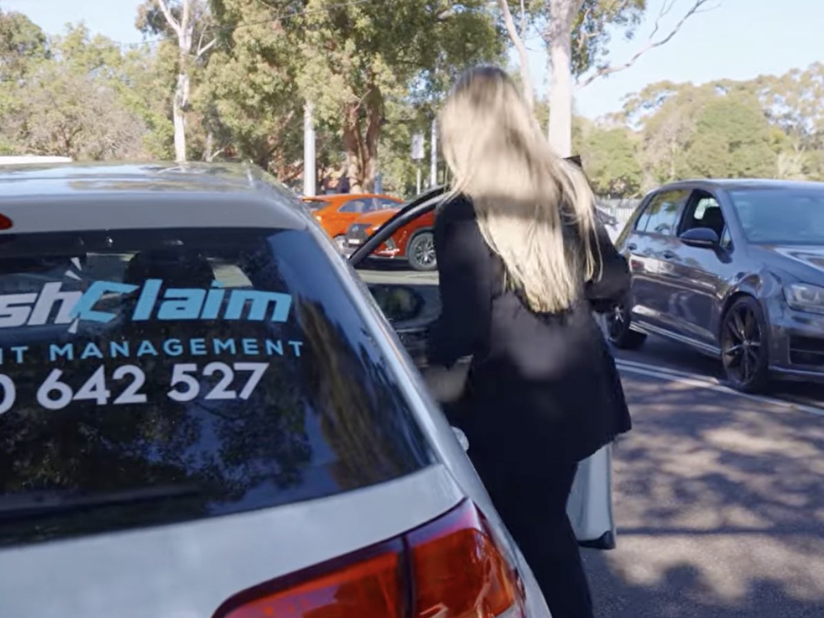 Happy CrashClaim customer with a work truck in NSW