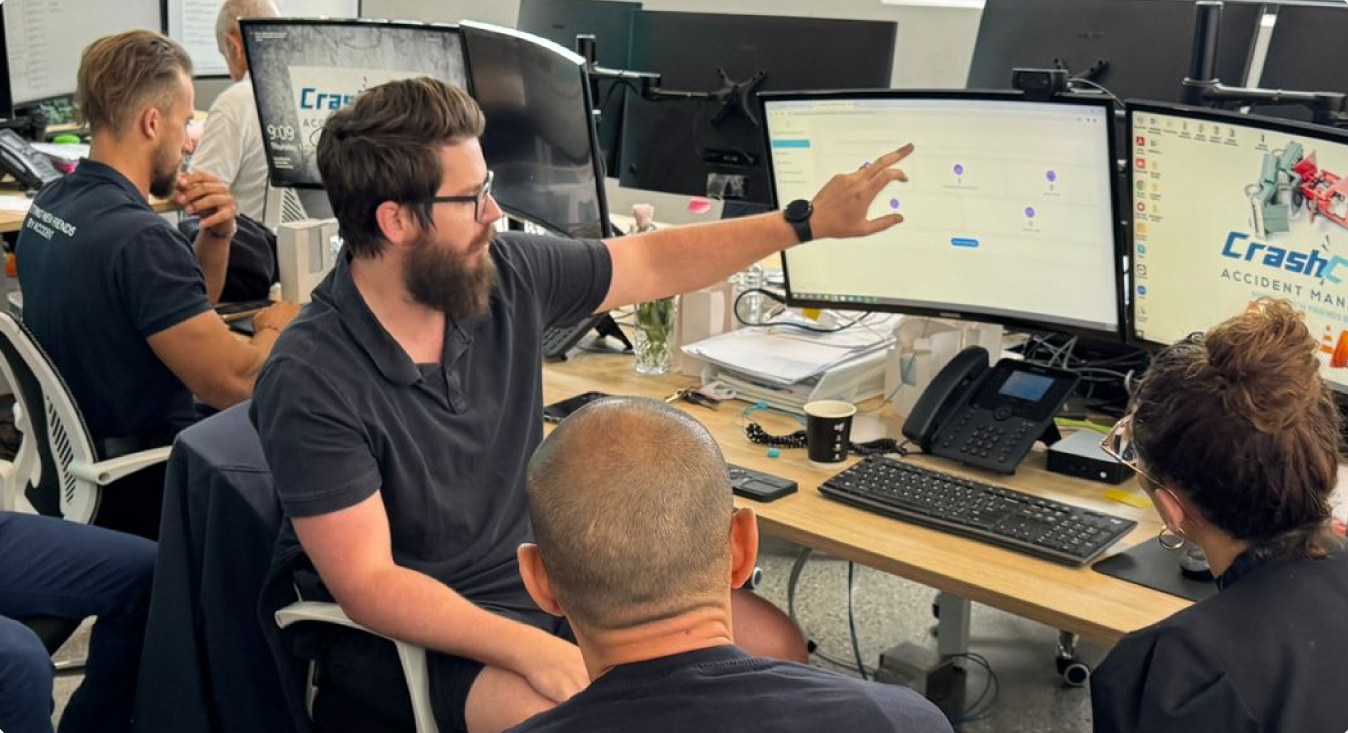 CrashClaim team reviewing an accident claim in the NSW office