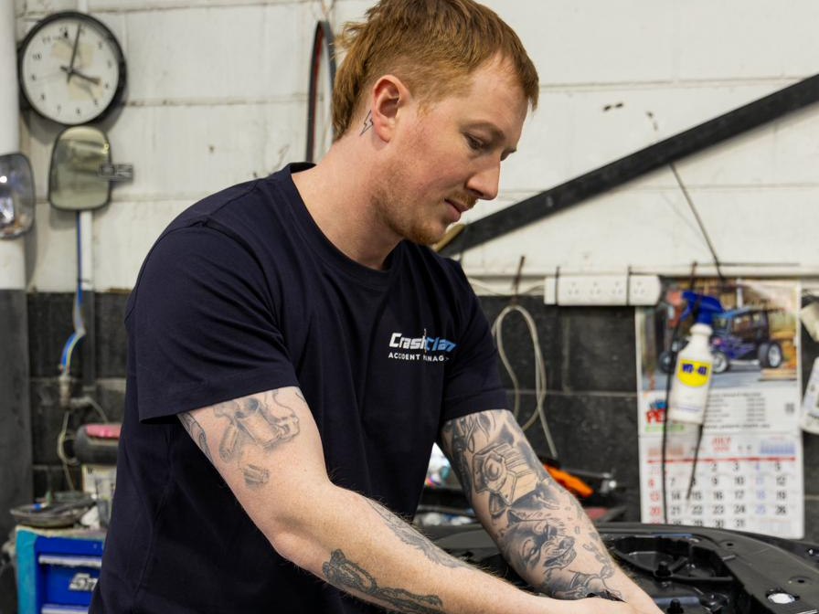 CrashClaim technician repairing a work vehicle in NSW
